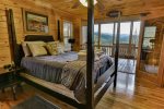 Queen bedroom on main level with deck access